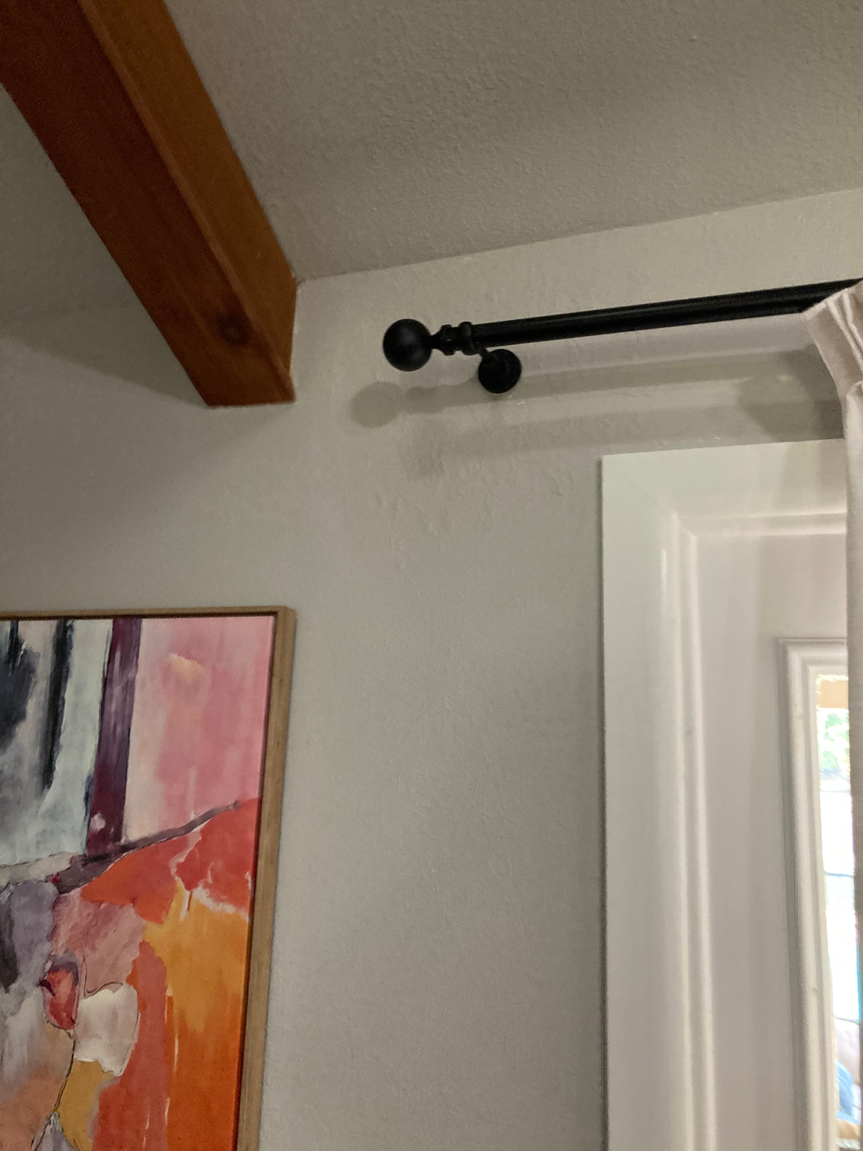 Drywall Repair, Curtain Rod Reinstallation & Picture Hanging after