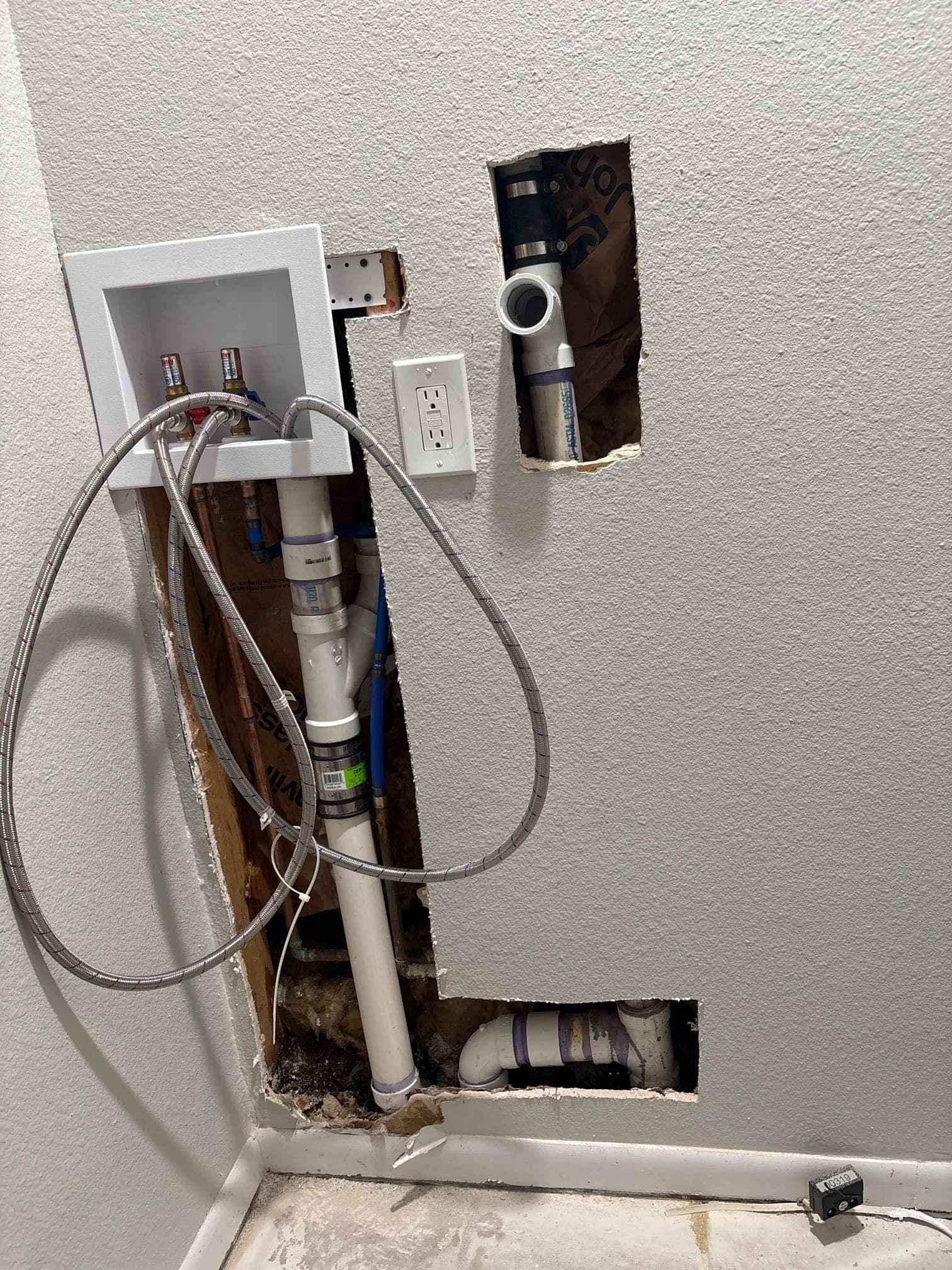 Laundry Room Drywall Repair After Plumbing Work before